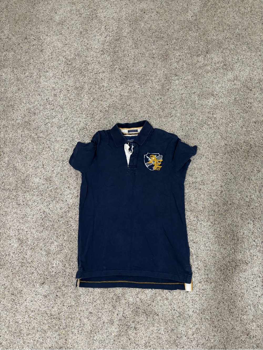 American Eagle Outfitters Navy Polo with Yellow Crest Detail